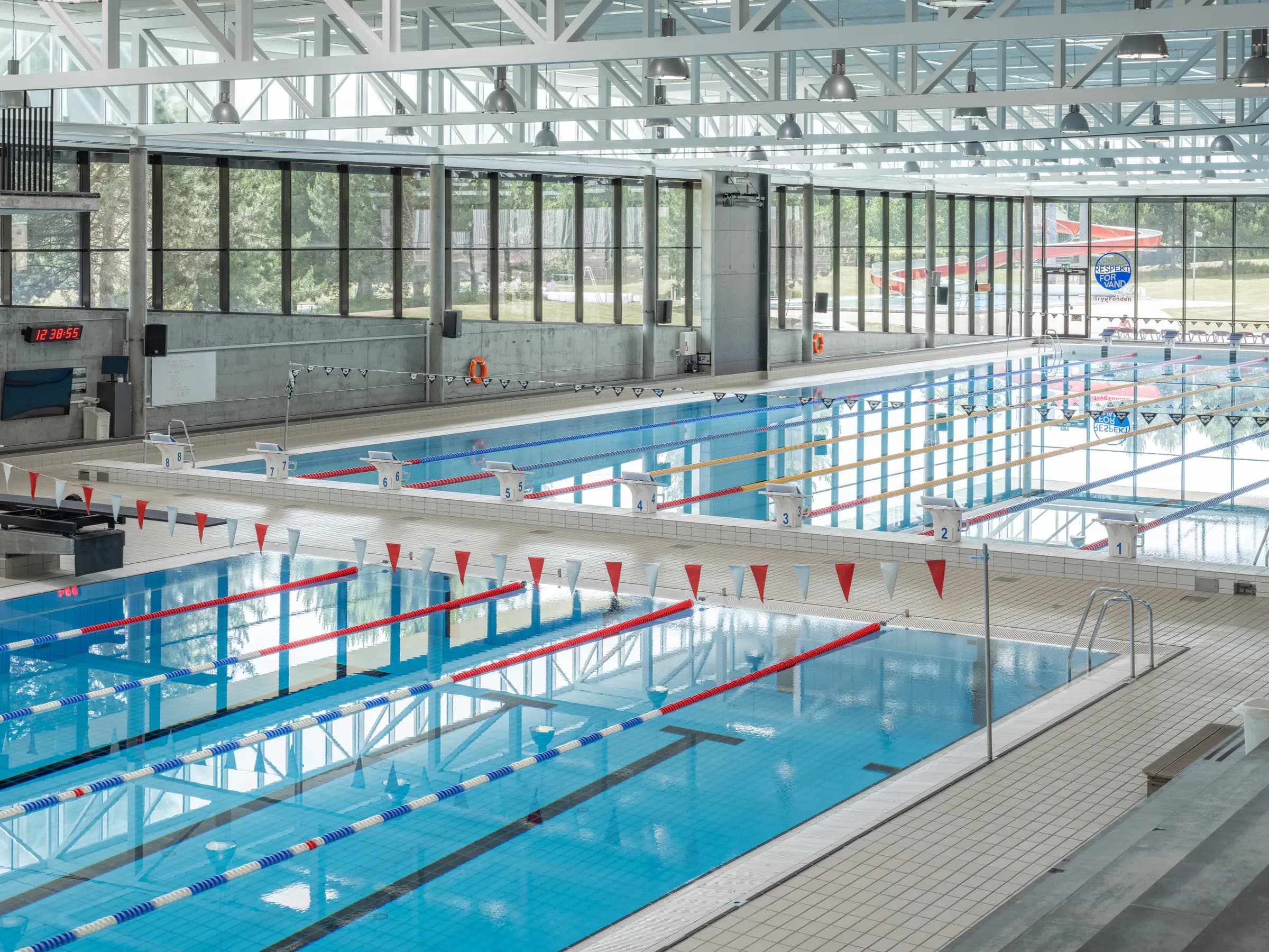 Pools and starting blocks inside Bellahøj Swimming Stadium