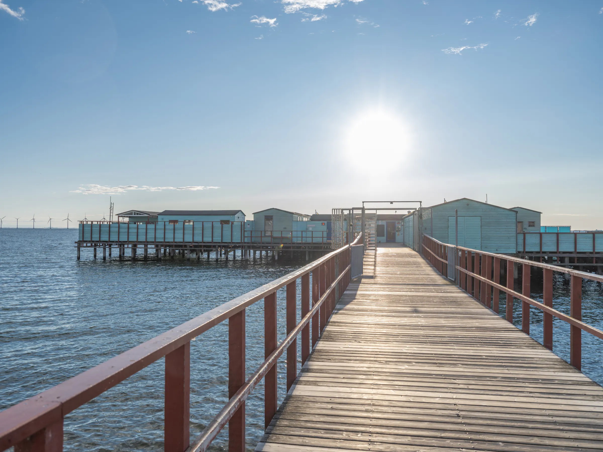 The footbridge to Helgoland Sea Bath in low evening sunlight